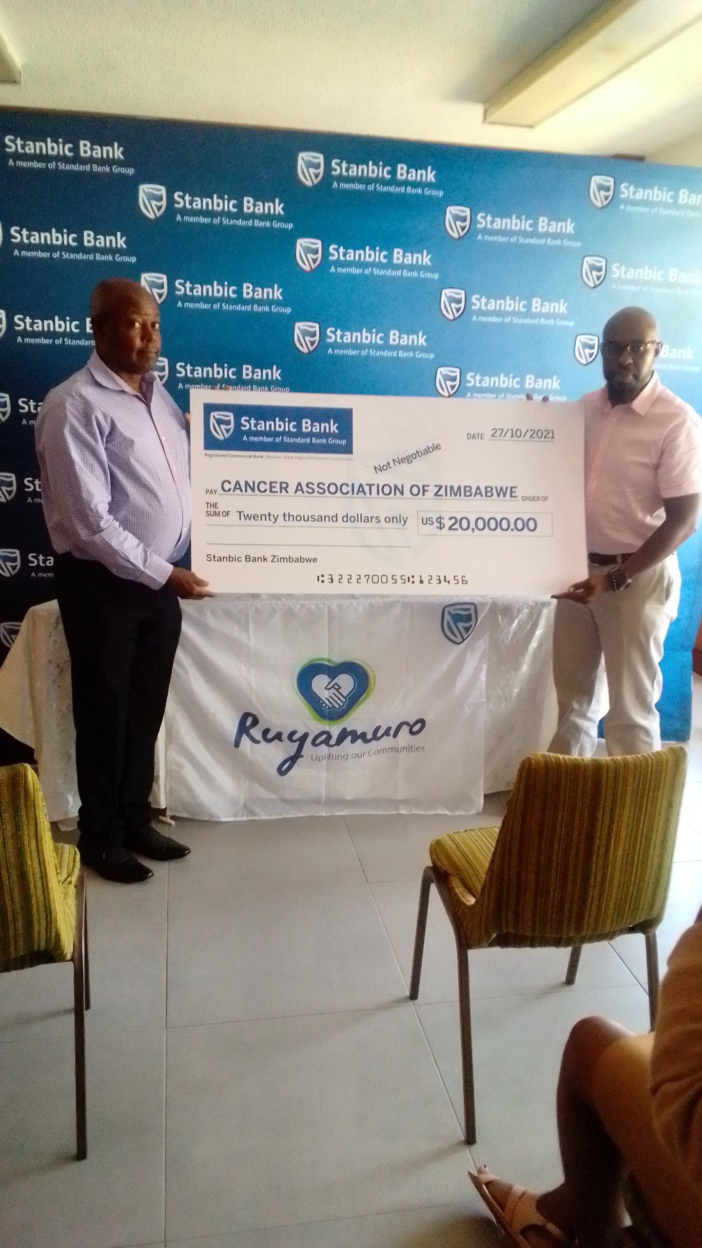 CAZ Chairperson, Eugene Mlambo(left) and Stanbic Bank Non-Executive Director Simbarashe Mhuriro (right)